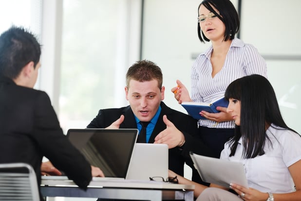 Business executives at a meeting discussing a work