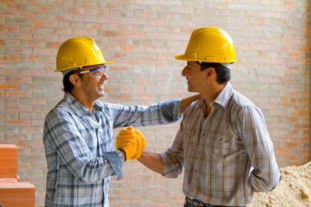 Happy construction workers wearing helmets - teamwork concepts-1
